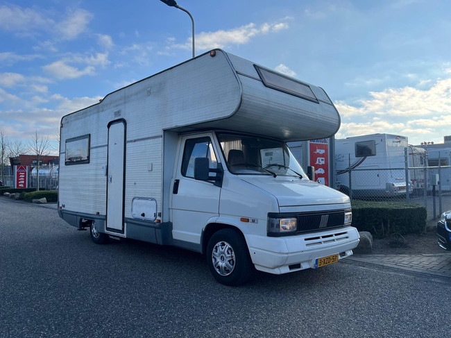 Fiat Ducato 14 2.5 Gran Volume | Goofy | Fietsenrek | Trekhaak | 7 Persoons | Kachel | Koelkast | Alkoofbed | 2x Treinzit
