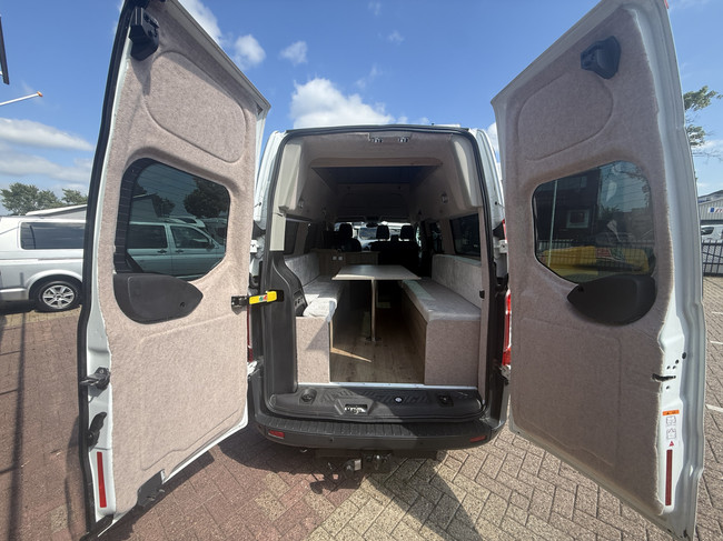 Ford transit buscamper professioneel omgebouwd hefdak airco cruise ctr 2 slaapplaatsen luifel thule trekhaak apk t/m 30-09-2027 foto: 6