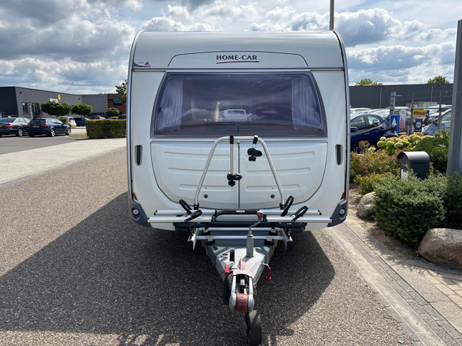 HOME-CAR 526h Racer 470 UE | 2 Enkele bedden | Volautomatische mover | Fietsendrager | Zakluifel | 3-Pits gasfornuis