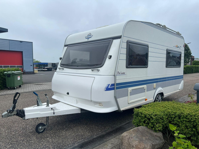 Hobby De Luxe 400 SF | Awning | Bicycle rack | Semi-automatic Mover | Fixed bed | Dinette (Train seat) | Tempo 100 | Shock absorbers photo: 2